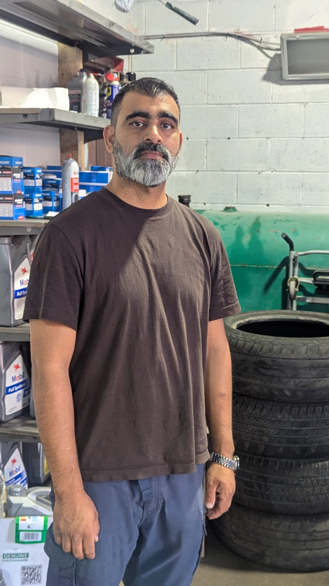 Rickey, owner of Rexdale Auto Detailing, in the shop